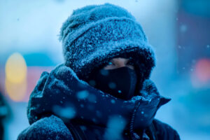 A person bundled up in warm winter attire. --ar 3:2 --v 6.1 Job ID: 31b6f7c3-410f-4824-ad68-cad021f43a7d